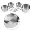 A set of stainless steel measuring cups and spoons arranged in a fan shape on a white background. Podgląd zdjęcia produktu