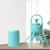 A teal-colored dog poop scooper and its cap are displayed on a wooden surface against a light background. Produktbild-Vorschau