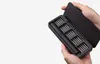 Hands holding an open black case containing an electric screwdriver and multiple bits. Náhled obrázku produktu
