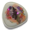 A close-up of a decorative item with a horse illustration and lights. Produktbild-Vorschau