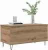 A wooden coffee table with books and a vase of greenery on top, set against a white background. Voir les images du produit