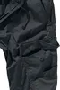 A close-up view of a pair of black cargo pants, focusing on the pocket and drawstring details. Anteprima dell’immagine prodotto