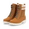 A pair of brown lace-up boots with white soles, shown against a white background. Produktbild-Vorschau
