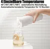 A hand is pouring water from a white electric kettle into a glass with a slice of lemon. Produktbild-Vorschau