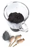 Poppy seeds in a blender jar, with a pile of seeds and poppy seed pods on a white background. Podgląd zdjęcia produktu