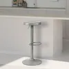 A silver bar stool is shown in a kitchen setting, with a counter and cabinets in the background. Náhľad obrázku produktu
