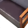 A close-up view of a section of a sofa with a woven rattan base and wooden armrests. Náhled obrázku produktu