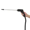 A hand holding a black and silver steam cleaner wand with a black hose attached. Náhled obrázku produktu