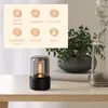 Aroma diffuser on a wooden table with a plant in the background. A graphic overlay lists product features. Podgląd zdjęcia produktu