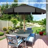 A patio set with a large umbrella on a wooden deck in a backyard. Produktbild-Vorschau