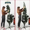 A woman assembling a Christmas tree. Náhled obrázku produktu