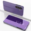 A purple smartphone case with a flip cover is shown in two views against a white and light gray background. Náhled obrázku produktu
