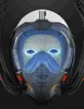 A close-up, front-facing view of a futuristic-looking snorkel mask with a wireframe overlay highlighting its internal structure and glowing blue eyes. Podgląd zdjęcia produktu
