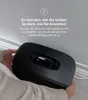A person is holding a black electronic device with a screen and buttons. Anteprima dell’immagine prodotto