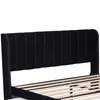 Close-up of a black upholstered bed frame headboard and wooden slats. Anteprima dell’immagine prodotto
