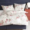 A bed with a duvet cover and pillowcases featuring a snowman pattern. Produktbild-Vorschau