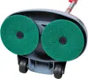 The underside of a floor polisher with two green scrubbing pads and wheels. Voir les images du produit