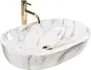 A white oval countertop sink with a marble pattern and a gold faucet. Anteprima dell’immagine prodotto