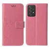 A pink flip phone case with a floral and butterfly embossed design is shown open and closed. Produktbild-Vorschau