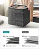 A person is holding a fabric storage box filled with folded clothes. Below the main image, there are two comparison diagrams showing the material composition of "Unsere" (Our) and "Andere" (Other) storage boxes. Produktbild-Vorschau