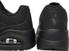 Close-up view of the back of two black sports shoes. Produktbild-Vorschau