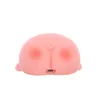 A pink, pig-shaped night light is shown from the back. Podgląd zdjęcia produktu