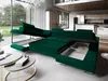 A large, modular green sofa is displayed in a modern living room, with parts of it extended to show storage compartments. Podgląd zdjęcia produktu