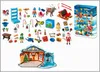 A collection of Playmobil figures and accessories, including a Christmas-themed advent calendar, a reindeer, a sleigh, and various small toys and decorations. Produktbild-Vorschau