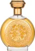A round, golden perfume bottle with an ornate embossed design on the front. Voir les images du produit