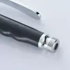 A close-up shot of the end of a black and silver kitchen spray nozzle. Produktbild-Vorschau