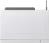 A top-down view of a white microwave oven. Voir les images du produit