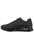 A side view of a black sneaker on a white background. Voir les images du produit