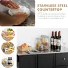 Collage of images showing a stainless steel countertop, food preparation, buffet display, and storage. Náhľad obrázku produktu