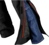 A close-up view of motorcycle pants, showing the outer black layer with red trim and a blue denim layer underneath. Náhled obrázku produktu