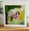 A framed 3D artwork depicting a family of four sitting on a swing under a tree, with a heart shape in the background. Náhled obrázku produktu