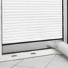 A close-up of a portable air conditioner vent kit installed in a window. Voir les images du produit