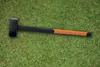 A sledgehammer lying on a grassy lawn. Náhľad obrázku produktu