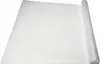 A roll of white anti-slip drawer liner is unrolled on a white surface. Voir les images du produit