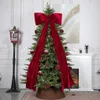 A decorated Christmas tree in a living room setting with a fireplace and a lamp post. Náhľad obrázku produktu