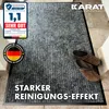 A doormat with shoes on it, placed on a tiled floor. Náhled obrázku produktu