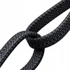 A close-up shot of a black braided USB-C cable tied in a knot. Anteprima dell’immagine prodotto