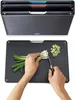 A set of cutting boards is shown in a holder, and another cutting board is being used to chop green onions. Anteprima dell’immagine prodotto