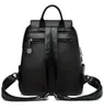 Back view of a black leather backpack. Podgląd zdjęcia produktu