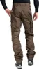 Rear view of a person wearing brown cargo pants and shoes. Anteprima dell’immagine prodotto