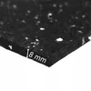 A close-up view of a black rubber mat with white flecks, showing its thickness. Produktbild-Vorschau