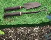 Gardening tools are placed on grass and mulch. Produktbild-Vorschau