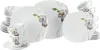 A collection of white porcelain dinnerware with an orchid design, including plates and cups. Produktbild-Vorschau
