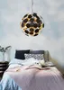 A bedroom scene with a bed, pillows, and a pendant light. Podgląd zdjęcia produktu