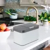 A kitchen counter with a compost bin, fruit bowl, and kitchen utensils. Produktbild-Vorschau
