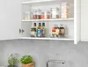 A kitchen cabinet with shelves holding various food storage containers and bottles. Produktbild-Vorschau